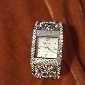p.o.v. bracelet watch. Silver tone with blue jewel